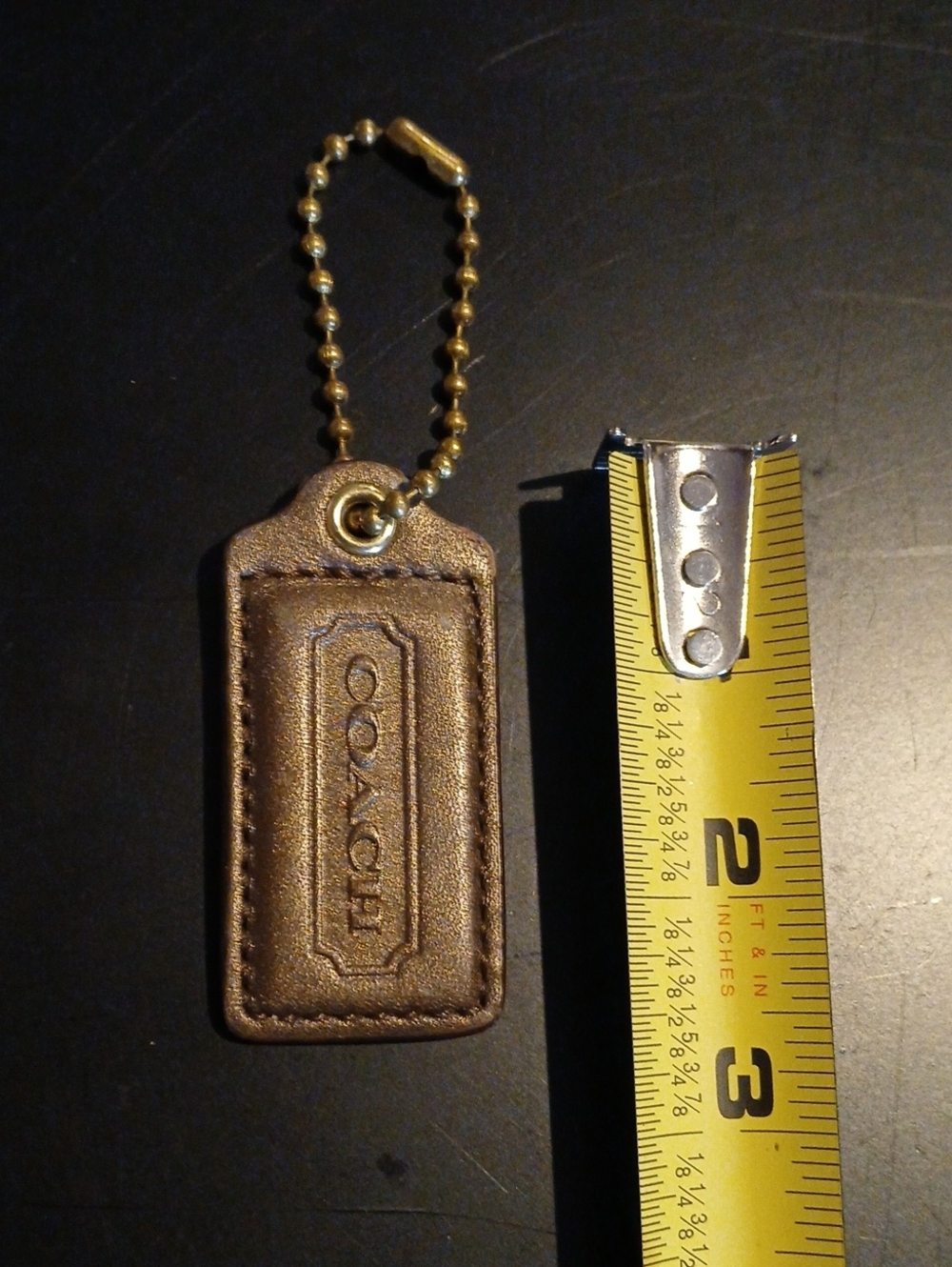 Coach Bronze Leather Hangtag